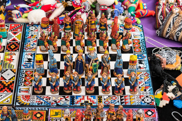 The traditional chess game, handicraft market in Cusco, Peru - obrazy, fototapety, plakaty