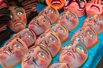 Traditional festival masks, craft market of Pisac, near Cusco, Peru. - obrazy, fototapety, plakaty