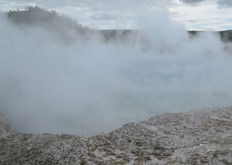Late Spring in Yellowstone National Park: Dense Steam Rises From Excelsior Geyser Crater in Midway Geyser Basin