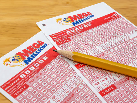 ATLANTA, GEORGIA - MARCH 31, 2019 : Mega Millions lottery ticket play slips. The Mega Millions lotto game is available in 44 states plus the District of Columbia and the U. S. Virgin Islands.