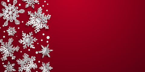 Christmas background with volume paper snowflakes with soft shadows on red background