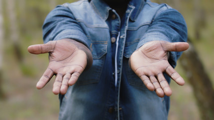 African man showing the palm of his hands. Black lives matter. High quality photo