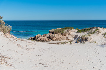 Fototapeta na wymiar Sandy Cape Recreation Park with white sand, turquoise water, excellent fishing and safe swimming areas makes this a great family camping area close to Perth.