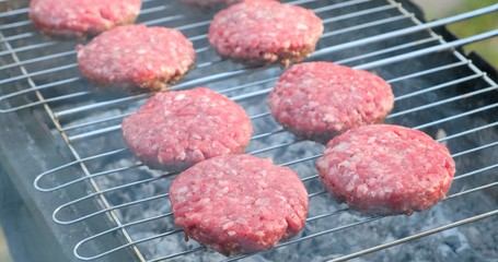 Beef and Pork Patty for Burger. Cooking Cutlets on Mangal. Grill Minced Meat. Chef Cooks burger in street outdoors. Summer Picnic in Nature. Tasty Meat Dish. Closeup