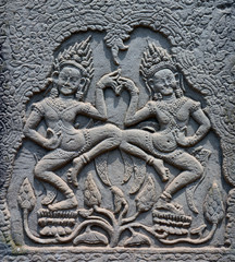 Stone carving of dancers,  in a temple at Angkor Wat, Cambodia