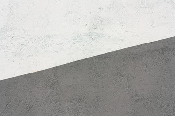 White gray diagonal cement background.