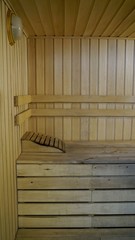 Sauna accessories are in the interior of the steam room. The interior of the sauna. Sauna from linden.