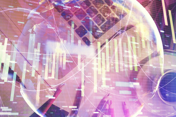 Business theme hologram drawings over computer on the desktop background. Top view. Multi exposure. Concept of international connections.