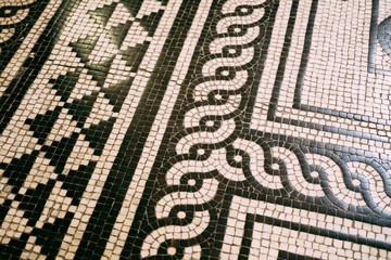 Black and white mosaic on the floor at the Budapest Opera.