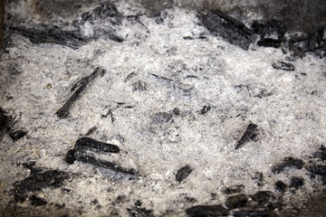 Charcoal remains on a barbecue