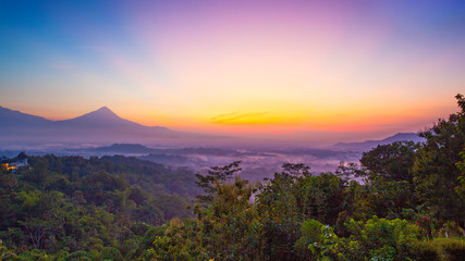 Naklejka na ściany i meble Sunrise view on the mountains and hills around Borobudur