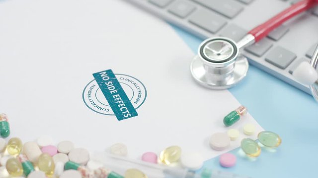 CLINICALLY PROVEN, NO SIDE EFFECTS blue stamp on the paper, medicine related shot