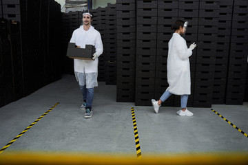 Warehouse supervisor staring at her tablet computer