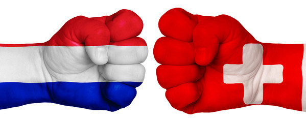 Two hands are clenched into fists and are located opposite each other. Hands painted in the colors of the flags of the countries. France vs Switzerland