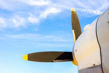 Airplane propeller against the blue sky.