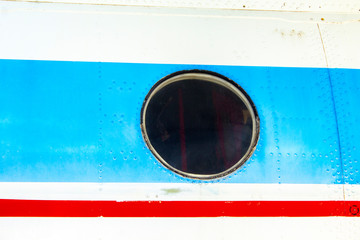 View of the fuselage of the aircraft and many windows, jetliner body casing.