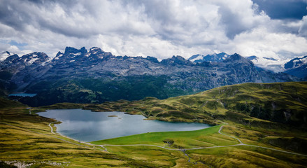 Wonderful Mountain Lake called Tannensee in the Swiss Alps - aerial photography