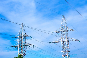 electrical wire towers on blue sky background