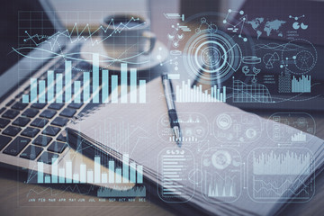 Double exposure of forex chart drawing and desktop with coffee and items on table background. Concept of financial market trading