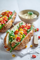 Delicious hot dogs with corn, chilli and sauce