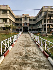 Fototapeta na wymiar Wide angle shot of the Vivekananda Shiksha Niketan building at Joygopalpur in West Bengal state in India- 9th Feb 2018