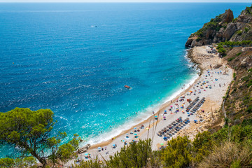 Fototapeta premium Beautiful Cala del Moraig beach with pristine turqouise water in Benitachell, Costa Blanca, Spain