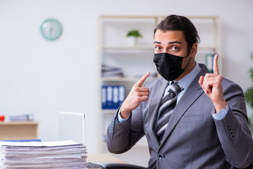 Young male employee in self-quarantine concept