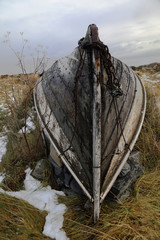 Old norwegian traditional wooden fishing boat from the period of second World war. Gamvik, Finnmark, Norway. Selective focus.