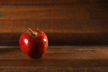 Red apple with rustic wood background