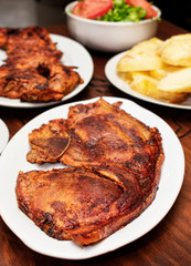 
grilled chicken, grilled pork plus potatoes