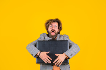 Business. Office worker. Surprised businessman with suitcase. CEO. Bearded businessman in suit. Business, people and office concept. Messy bearded businessman with case.