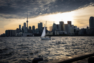 Sailboat with Toronto Skyline in background at sunset