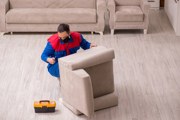 Young carpenter working indoors during pandemic disease