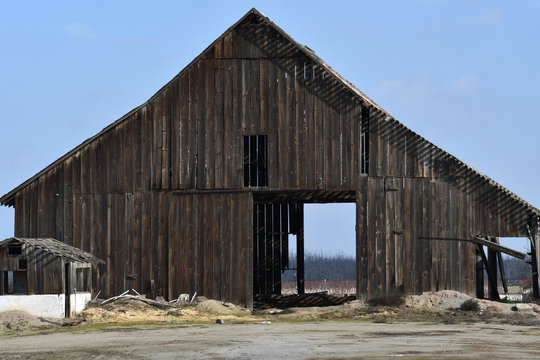 Landscape shot of an abandoned wooden farm
