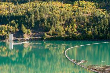 A log boom in the Carpenter Lake Reservoir at the Terzaghi dam in British Columbia, Canada