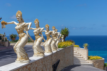 Sculptures of Balinese dances at the entrance to Melasti Beach (Pantai Melasti), Bukit, Bali, Indonesia.
