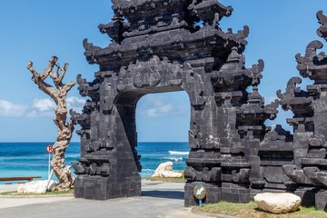 Gate to popular Melasti Beach (Pantai Melasti), Bukit, Bali, Indonesia. Turquoise water, ocean scenery.