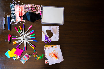 Back to School, stationery items display pencils, pen, scissiors, face mask, colour, pins
