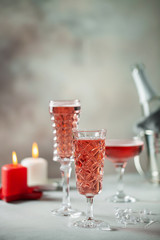 Two glasses of  champagne on dark wooden background. Festive drink. Valentins or Christmas concept.