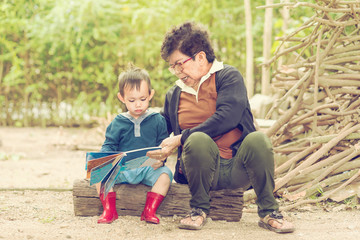 Gram mothers teach kid to read tales book 