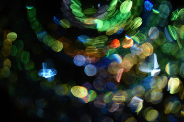 Closeup shot of colorful bokeh lights with a dark background