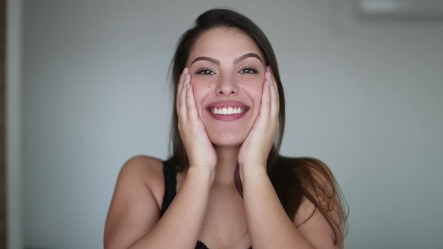 Attractive young woman shock surprise reaction emotion. Pretty girl reacting to good news