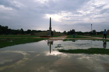 A beautiful scenery of the greenery and reflection in coronation park  delhi