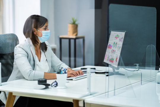 Employee In Office Social Distancing Using Sneeze Guard