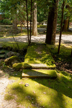 Mossy stone bridge in a Japanese garden in Moto-Ise shrine in Fukuchiyama city, Kyoto, Japan