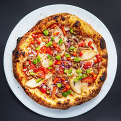 pizza on the black background, top view