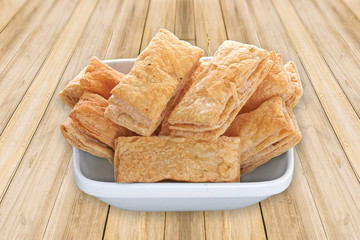 indian khari or kharee or salty Puff Pastry Snacks, with tea, Khari bread Rusk, Puff Pastry Snacks, fresh square shaped puff pastry biscuit snacks with puffed crispy golden brown crust layers khari