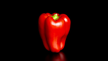 Red bell (sweet) pepper on black background