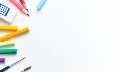 School supplies double side border. Top view isolated on a white background with copy space. Back to school concept.