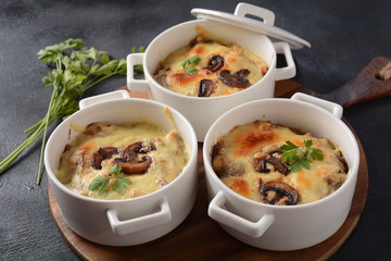 Julienne with chicken and mushrooms with a golden crust ,  baked cheese